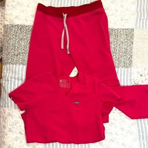 Figs hot pink scrubs; Livingston LT, one pocket top M